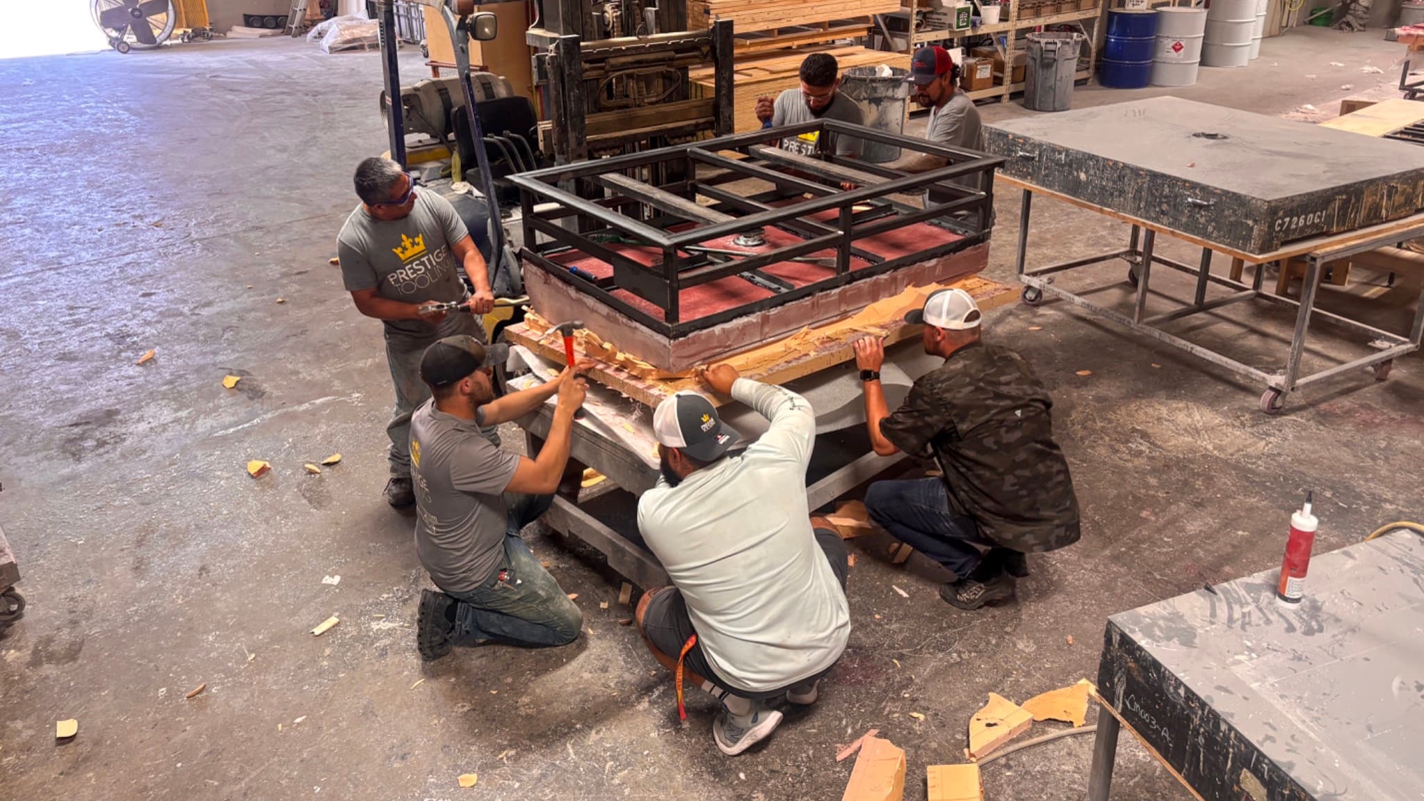 The Prestige Tooling crew working together on a mold in the shop