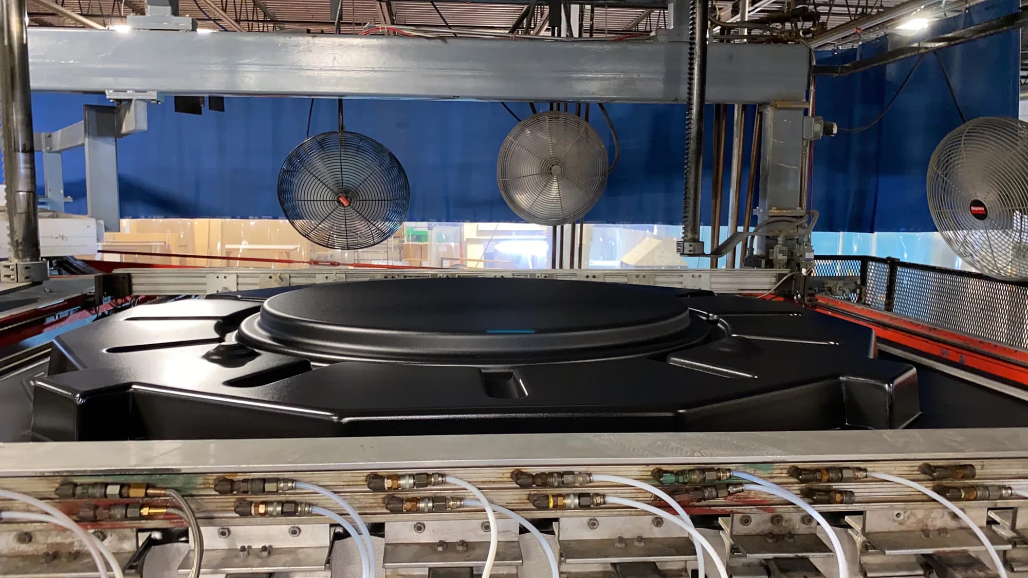 Black thermoplastic part cooling in a large thermoforming machine