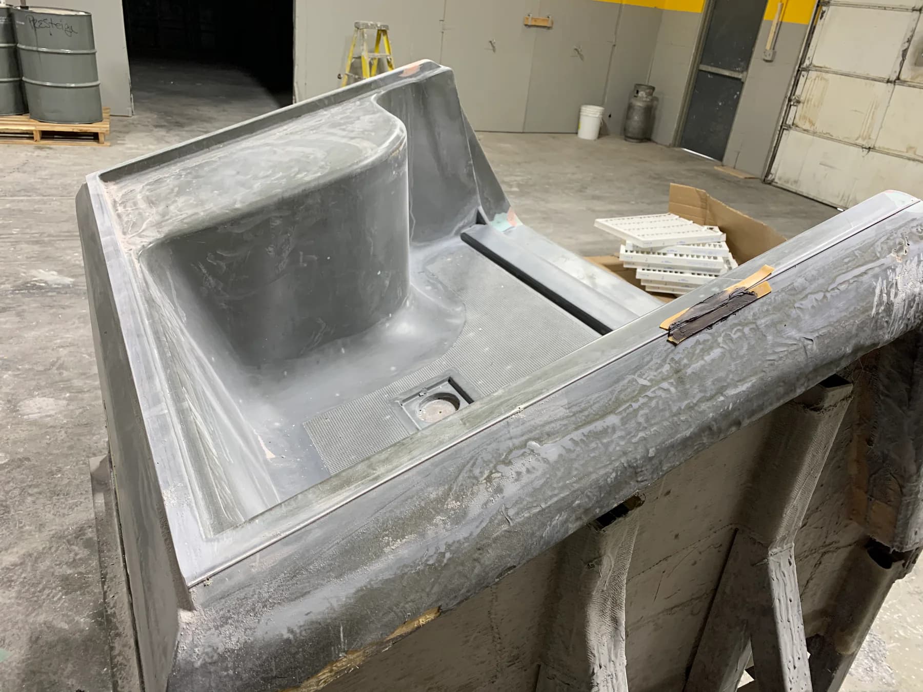 Multiple large ceramic composite thermoforming molds in the Prestige Tooling shop
