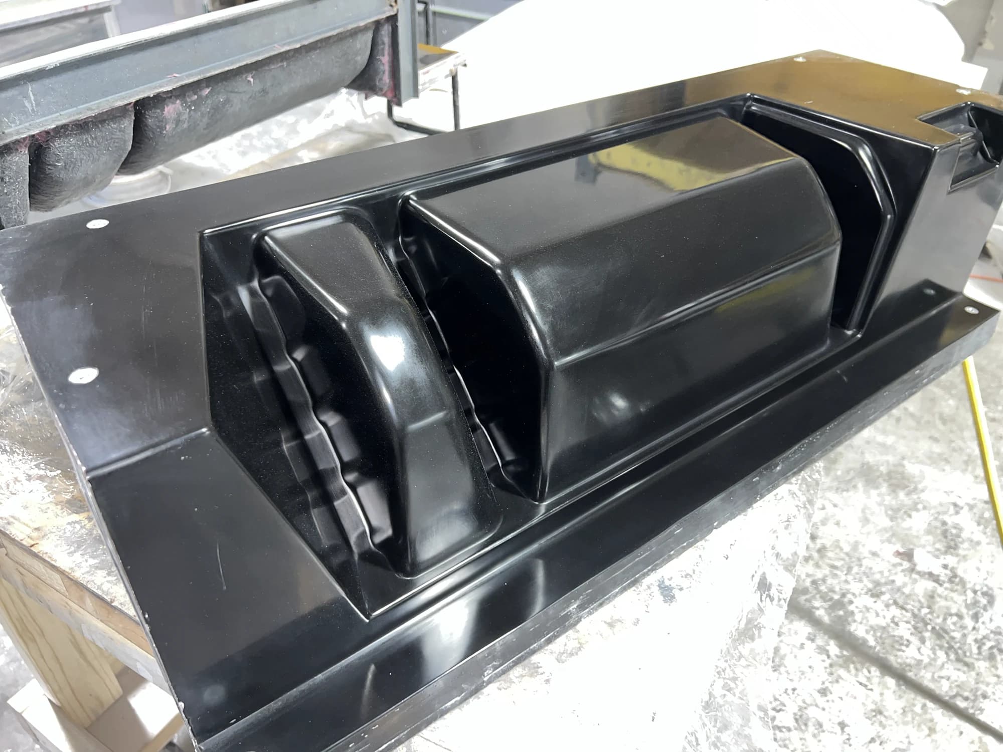 Polished black catalog production mold photographed in the Prestige shop