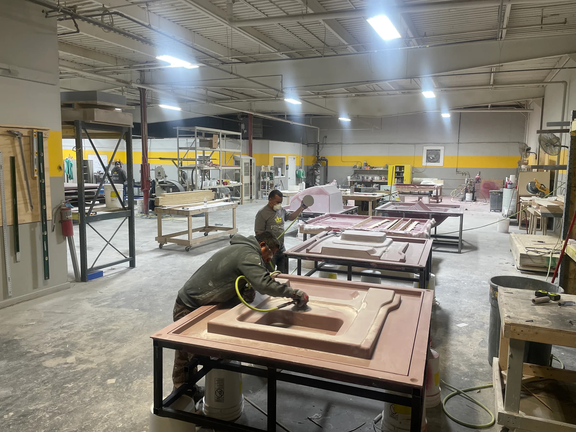 Prestige mold maker working on a large tool in the Elkhart shop