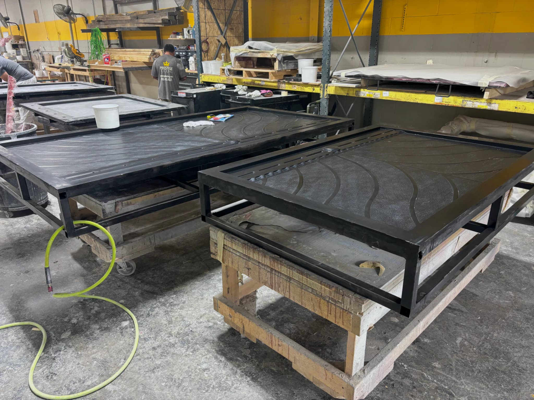 Workers handling tooling board blank