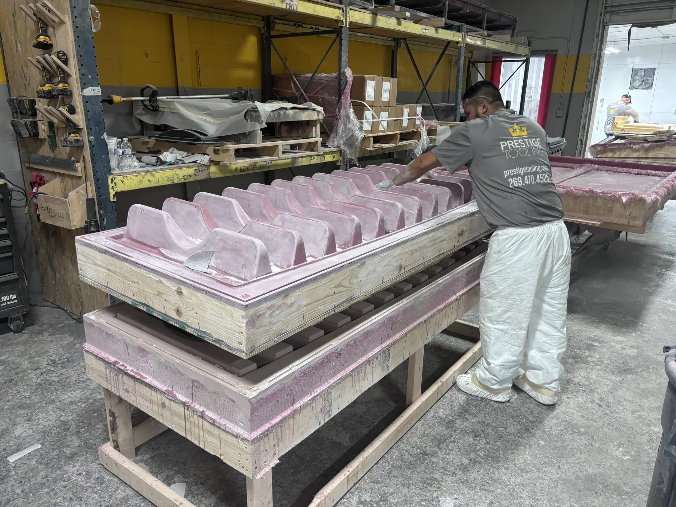 Prestige employee checking a thermoforming mold during quality control