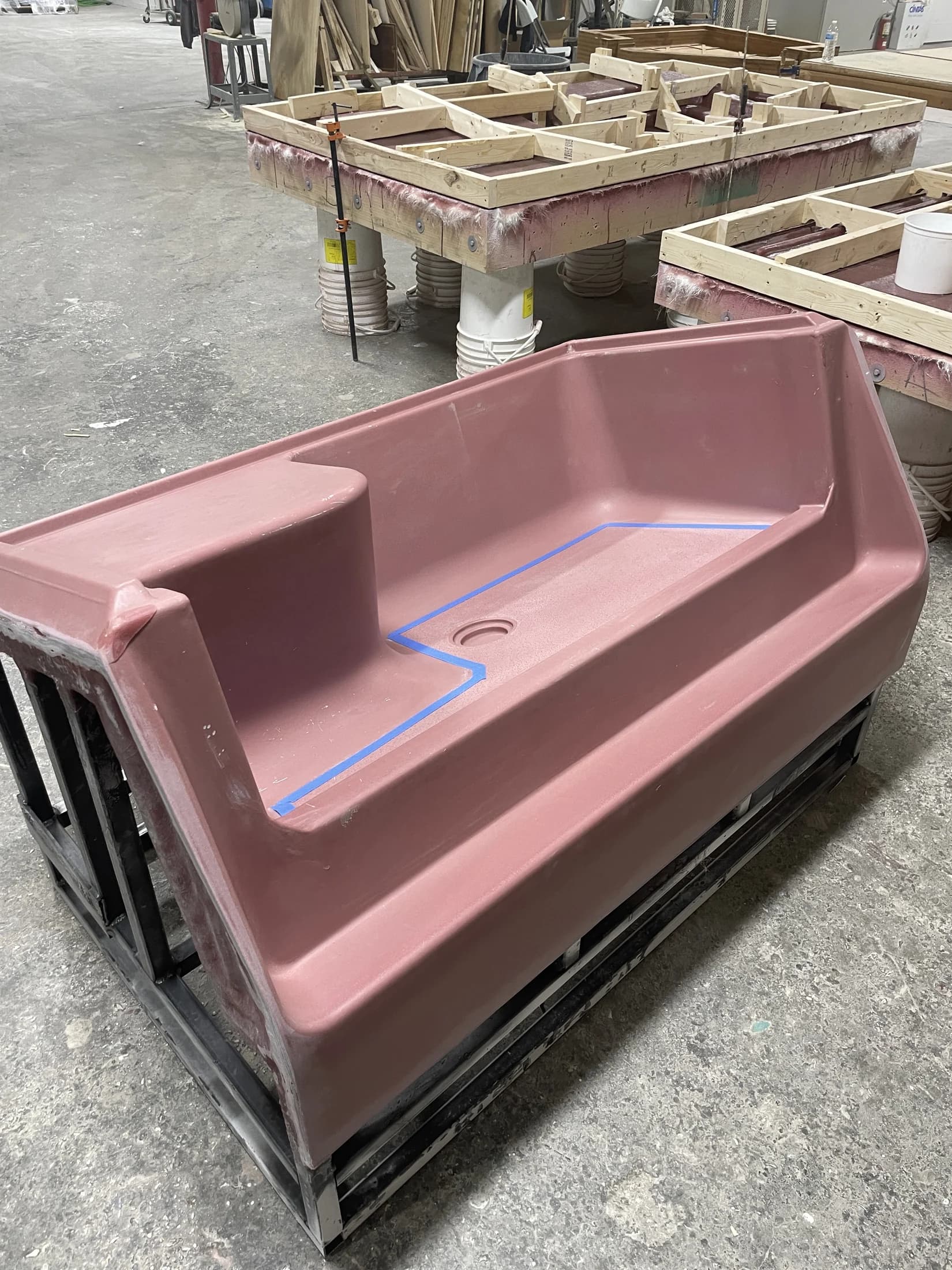 Completed thermoforming seated shower-base mold on its steel frame
