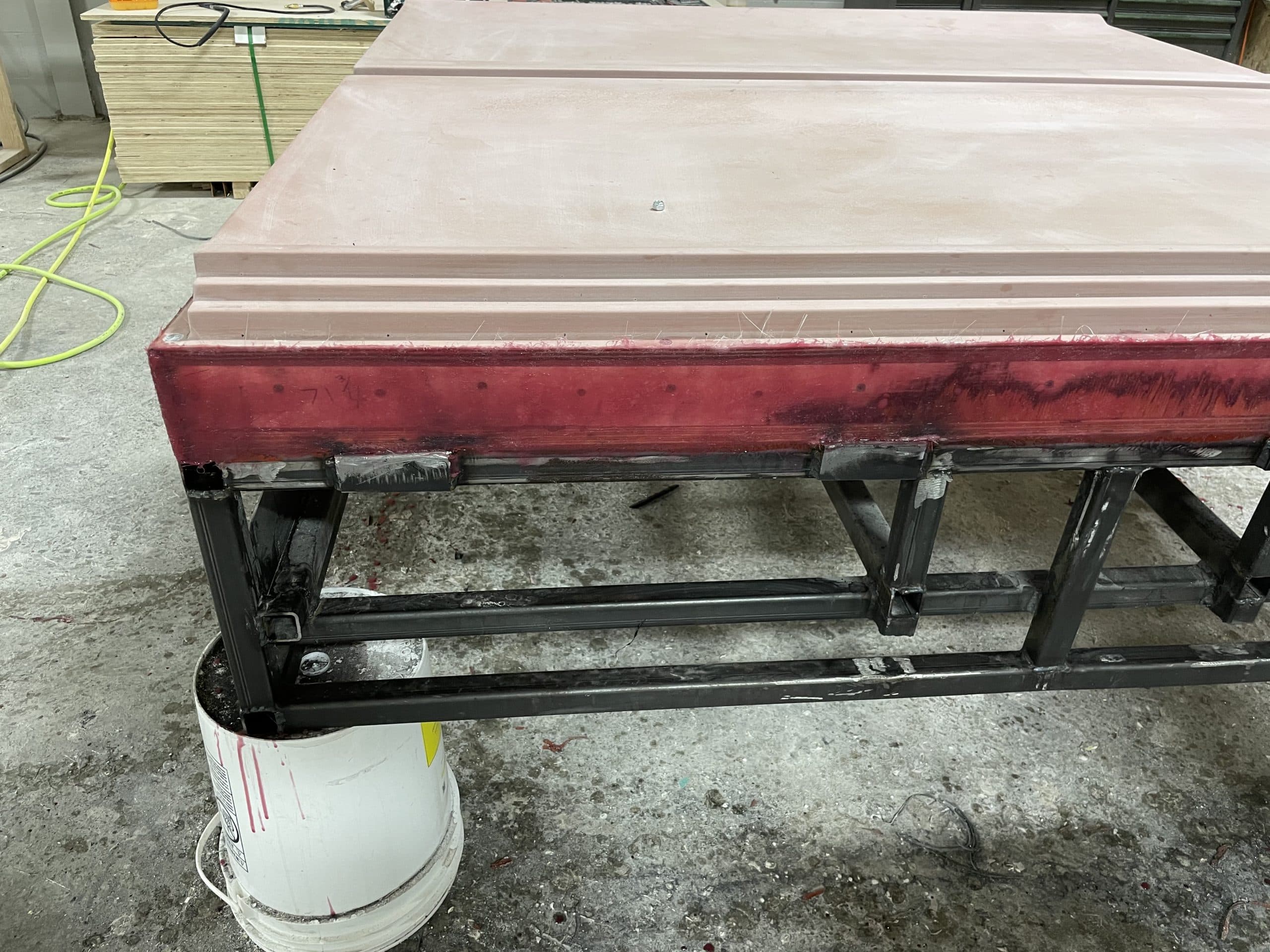 Large mold surface in progress on a steel support frame