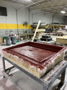 Shower pan in the lamination process before becoming a thermoforming tool